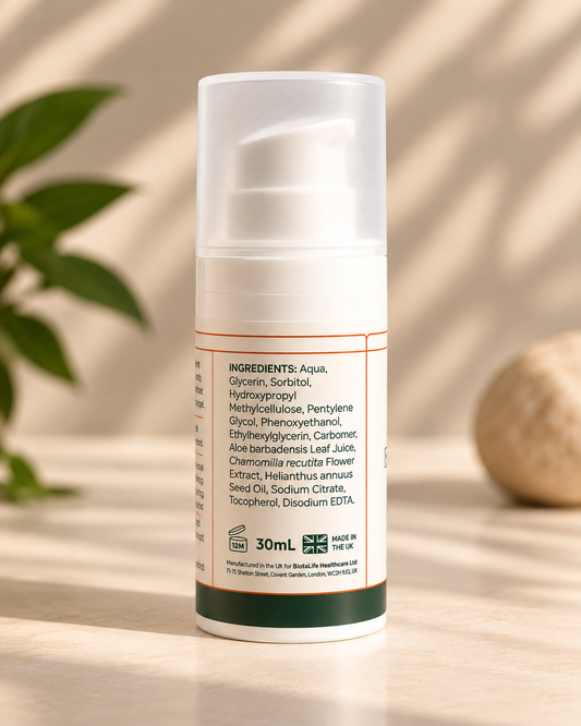 A 30ml pump bottle of Aquafaba Germ-Free face cream, featuring a white body with a clear cap and a dark green base band, set on a light surface with soft leaf shadows.